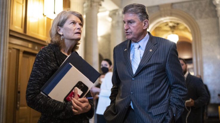 Sen. Lisa Murkowski (R-AK) with with Sen. Joe Manchin (D-WV) outside the Senate Chamber at the U.S. Capitol.