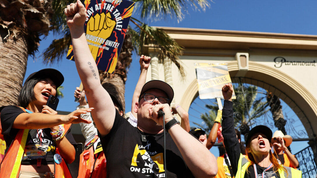 SAG-AFTRA National Executive Director and chief negotiator Duncan Crabtree-Ireland (C) raises his fist while speaking at the conclusion of picketing outside Paramount Studios on day 113 of their strike against the Hollywood studios on November 3, 2023, in Los Angeles, California.