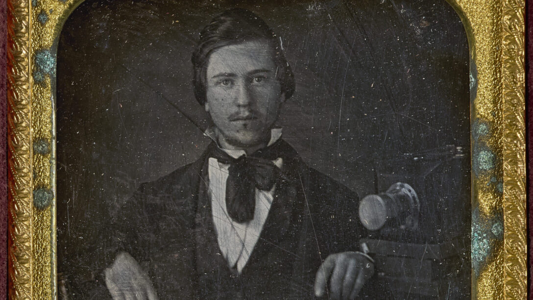 Daguerreotypist with Camera, c. 1850.